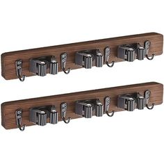 two wooden shelfs with metal hooks on them