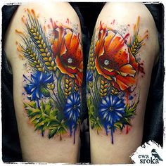 two colorful tattoos with flowers and plants on their arms, both painted in different colors