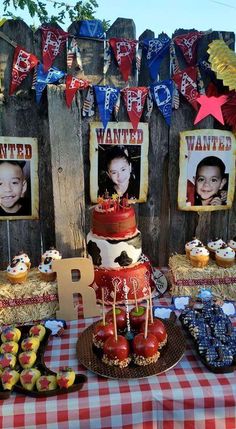 a table topped with lots of cakes and desserts