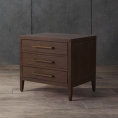 a small wooden cabinet with three drawers on the bottom and one drawer at the top