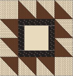 a brown and white patchwork quilt with a square in the center on top of it