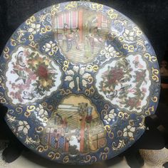 a decorative plate is sitting on a table