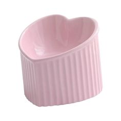 a pink heart shaped bowl on a white background