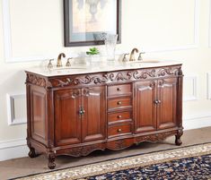 a bathroom vanity with marble top and two sinks