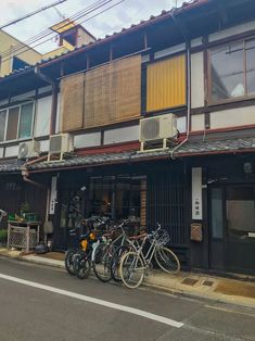 several bicycles are parked in front of a building