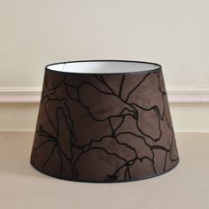 a black lamp shade sitting on top of a table