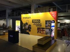 an exhibit stand with tools on display for sale