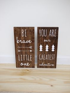 two wooden signs that say you are our greatest adventure and be brave