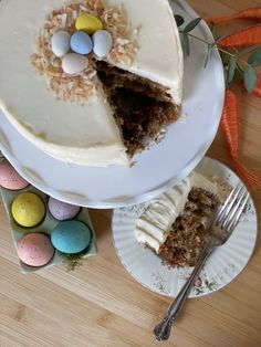 there is a cake on the table with eggs and carrots next to it,