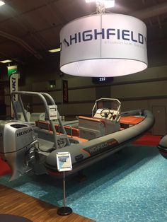 an inflatable boat is on display at a showroom for highfield boats