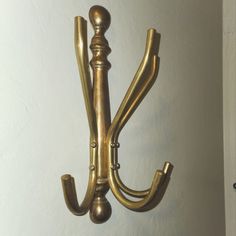 an old fashioned brass hook on the wall