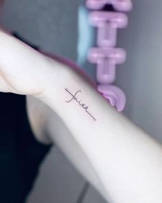 a woman's arm with the word hope tattooed on it