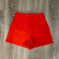 These Shorts Feature A Seamed Detail On The Front And Back, Welt Back Pockets, Front Zipper With Eyelet Hook Closure And A High Waist. Measurements Waist - 13” Rise - 11.5” Length- 4” Color - Orange Size - Xsmall Condition - Nwot Casual Solid Color Shorts For Party, Chic Stretch Red Shorts, Chic Red Stretch Shorts, Red High Waist Shorts For Day Out, Trendy Red Shorts For Night Out, Fitted Red Bottoms For Day Out, Red High-waisted Shorts For Party, Chic Red Bottoms With Built-in Shorts, Red High-waisted Shorts For Night Out