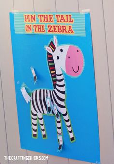 a paper cut out of a zebra with the words pin the tail on the zebra