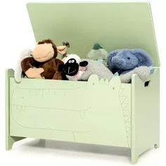 there are stuffed animals in the green toy box