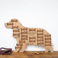 a wooden dog puzzle with dogs bones on it