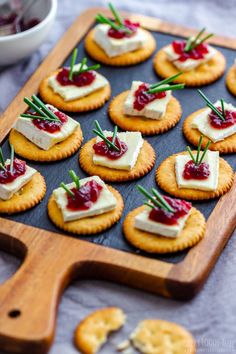 small crackers with cranberry sauce and cheese