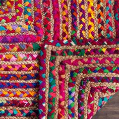 multicolored rugs are laid out on top of each other in different colors