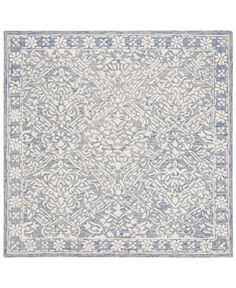 a blue and white rug with an intricate design