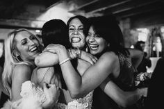 three women hugging each other at a party