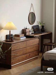 a bedroom with a bed, desk and lamp