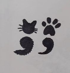 the cat paw prints are black on white paper