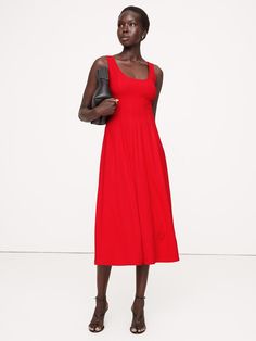 Cut from crepe to hug your curves, this timeless midi dress frames your décolletage thanks to a scoop neckline that's also mirrored at back.  Here, we kept the design details minimal so it will remain a favorite for years to come.  Fitted: Slim.  Sits close to the body with a fit & flare silhouette.  Scoop neck.  Scoop back.  Zip at back.  Lined bodice, unlined skirt.  Fitted: Slim.  Sits close to the body with a fit & flare silhouette.  Sleeveless.  Midi length.  Model: Size 2, 5'10" (178cm). Scoop Neck Midi Dress, Red Sunset, Red Midi Dress, Material Girls, Dress Red, Fit & Flare, Scoop Neckline, Midi Length, Jumpsuit Dress