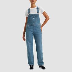 These Vintage Denim Overalls have all the familiar features you love that create an authentic look from top to bottom. Better with age and wear, this classic workwear essential has already become our closet staple to transition through the seasons. In 1873, Levi's ® invented the blue jean. What started as a piece of clothing for the American worker quickly became an icon of American style around the globe. And every Levi's ® style is crafted with the same high standard of craftsmanship and quali Medium Wash Cotton Overalls For Workwear, Levi's Casual Denim Overalls, Casual Levi's Denim Overalls, Levi's Cotton Overalls In Medium Wash, Levi's Cotton Medium Wash Overalls, Levi's Medium Wash Cotton Overalls, Levi's Casual Medium Wash Overalls, Medium Wash Relaxed Fit Overalls For Work, Light Wash Cotton Overalls For Work