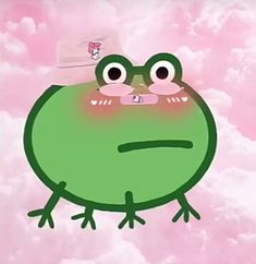 a green frog with a hat on its head sitting in front of pink sky and clouds