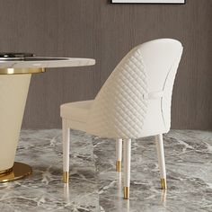 a white chair sitting next to a table on top of a marble floor