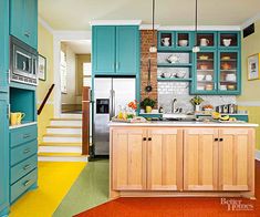 a kitchen with blue cabinets and yellow flooring