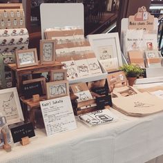 a table topped with lots of different types of cards and pictures on it's sides