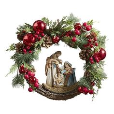 a nativity scene with pine cones, red berries and greenery on a white background