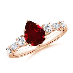 a red and white diamond ring with three stones