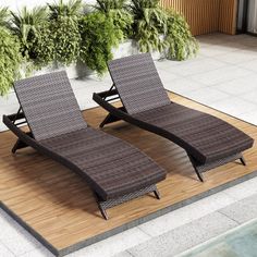 two lounge chairs sitting on top of a wooden floor