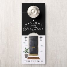 an open house door hanger with a welcome sign