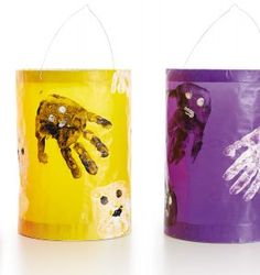 three different colored paper bags with hand prints on them and one is purple, the other is yellow