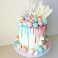 there is a cake that has been decorated with macaroons and marshmallows