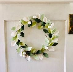 a wreath is hanging on the front door