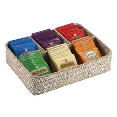 a wicker basket filled with lots of different types of chocolates on top of each other