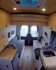 the interior of an rv is clean and ready to be used as a camper