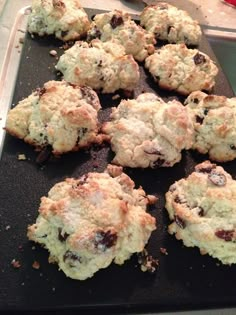 several cookies sitting on top of a cookie sheet with crumbs all over them