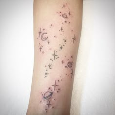 an arm with stars and planets on it