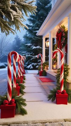 some candy canes and christmas decorations in front of a house