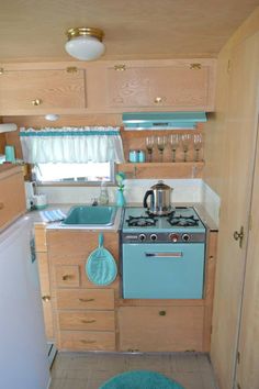 a small kitchen with an oven, sink and dishwasher