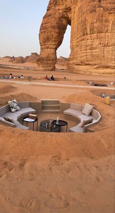 an outdoor seating area in the middle of desert