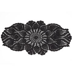 a black doily on a white background is shown in the shape of a flower