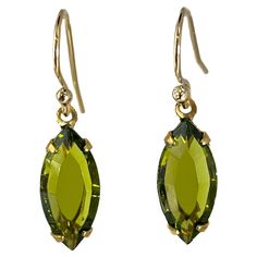 These delicate and elegant drop earrings are made from vintage crystal from Czech Republic. The crystal is made to resemble olivine. Each crystal drop measures 15 x 7 mm. They are set in an original brass prong setting. They are hanging from a gold fill French ear wire. PONTIEL Jewelry is designed from unique crystal and glass, dating from the Art Deco to Modernist eras, and originating from Czech Republic, Germany, and Austria. I hope you enjoy these timeless creations. Olivine Jewelry, Earrings For Sale, Green Jewelry, Jewelry Crystal, Old Jewelry, Crystal Drop, Vintage Crystal, Ear Wire, Czech Republic