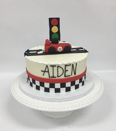 a birthday cake with a train on top and the name ardenn written on it