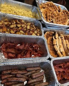 several pans filled with different types of food on tinfoil trays next to each other